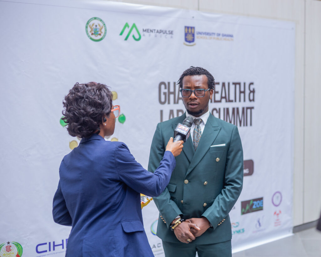 Man being interviewed by female journalist
